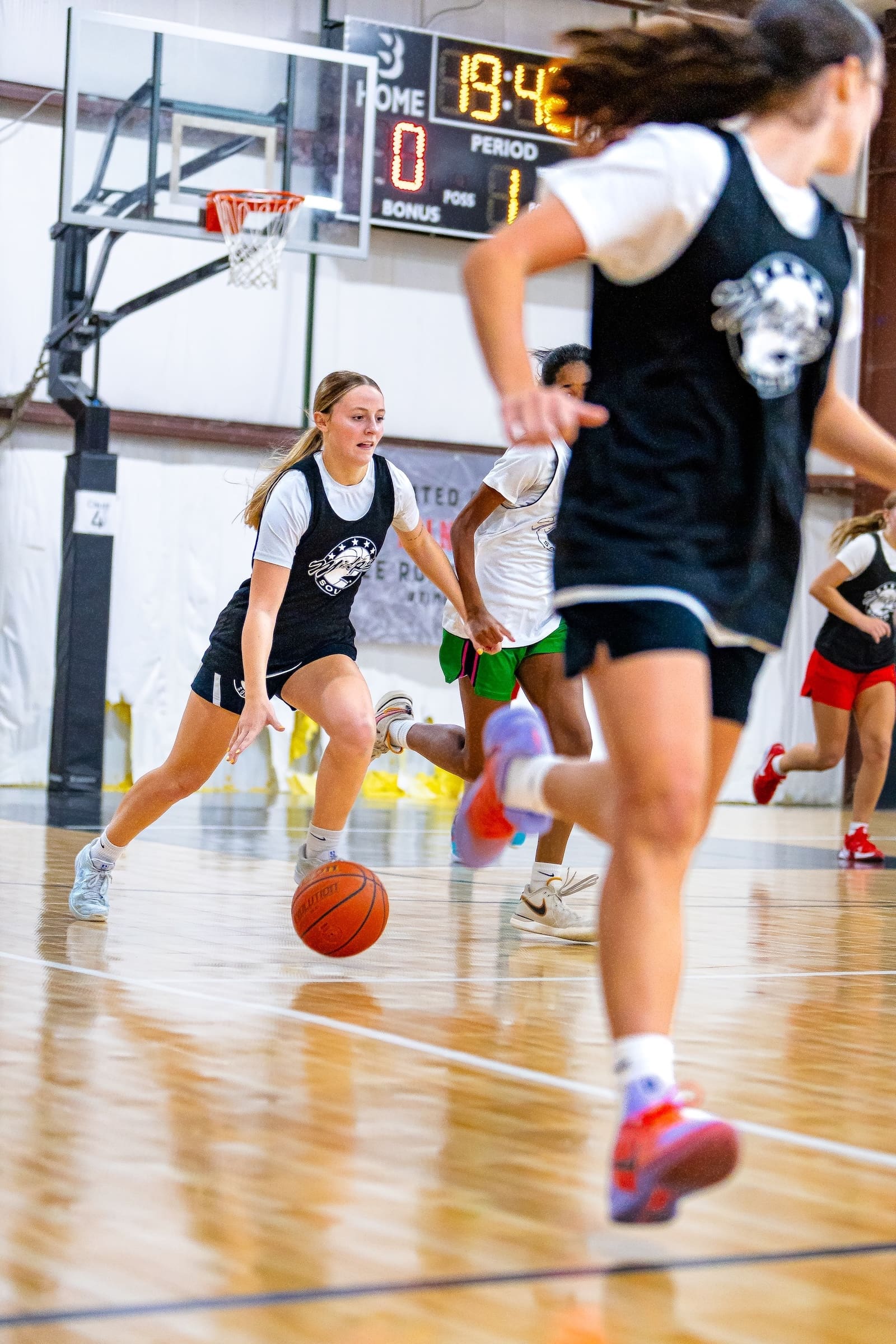 Girl Dribbling Basketball at Reps & Runs
